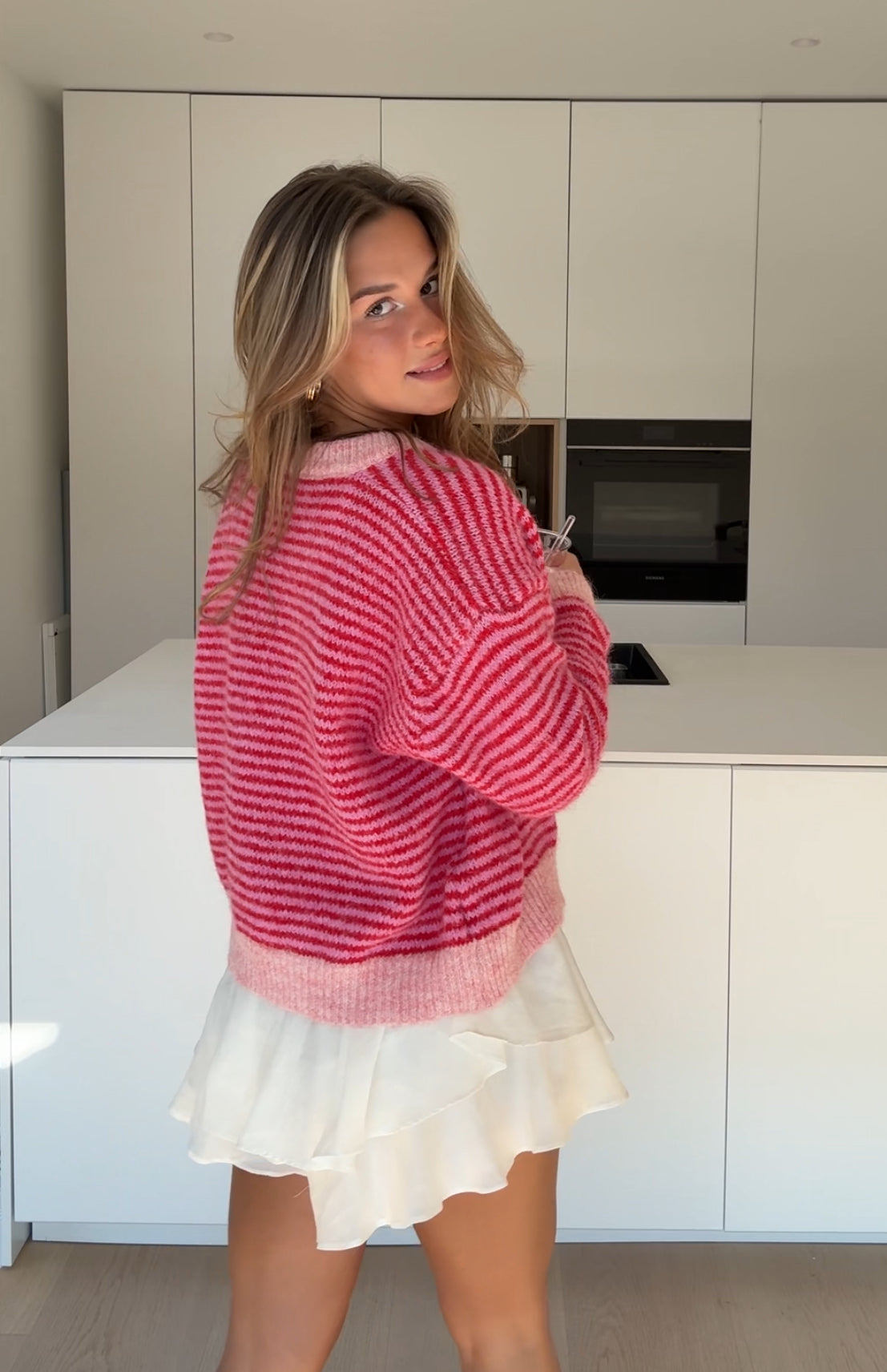 Cárdigan de rayas suave rosa