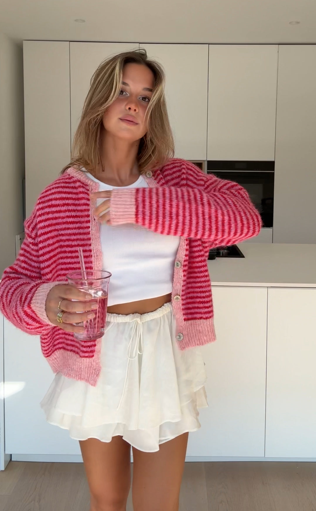Cárdigan de rayas suave rosa